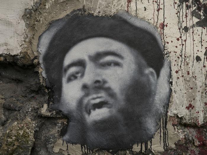 Un graffiti à l'effigie du visage de Baghdadi, l'autoproclamé calife de l'État Islamique. Photo via Flickr.